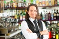Barista or barman behind his bar Royalty Free Stock Photo