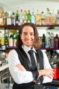 Barista or barman behind his bar Royalty Free Stock Photo