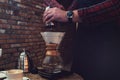 Barista brewing coffee