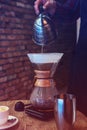 Barista brewing coffee