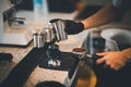 Barista cafe making coffee with manual lever espresso machine preparation service concept in restaurant.Close up hand barista Royalty Free Stock Photo