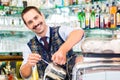 Barista in cafe pouring espresso shot in latte macchiato Royalty Free Stock Photo