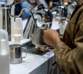 Barista Cafe steaming milk in stainless containner. Coffee Service Concept Royalty Free Stock Photo