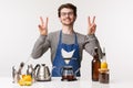 Barista, cafe worker and bartender concept. Portrait of cheerful friendly young male employee informal greeting dear Royalty Free Stock Photo