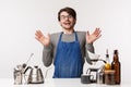 Barista, cafe worker and bartender concept. Surprised happy young man in apron, gasping amused and smiling cheerful