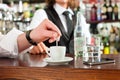 Barista with client in his cafe or coffeeshop