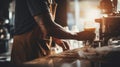 Barista creating latte art, blurred cafe environment