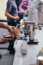 Barista driping coffee into white cups Royalty Free Stock Photo