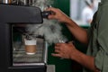 Barista Foaming milk.