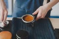 Barista girl prepares coffee Royalty Free Stock Photo