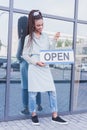 barista holding Open sign Royalty Free Stock Photo