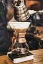 Barista making coffee in coffeeshop Royalty Free Stock Photo