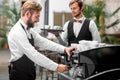 Barista making coffee with waiter Royalty Free Stock Photo