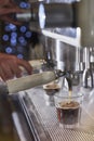 Barista making a espresso with a classic Italian coffee machine. Royalty Free Stock Photo
