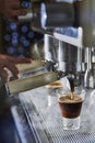 Barista making a espresso with a classic Italian coffee machine. Royalty Free Stock Photo