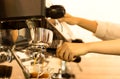 Barista making fresh espresso from coffee machine Royalty Free Stock Photo