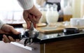 Barista making fresh espresso coffee. The shopkeeper preparing coffee on counter Royalty Free Stock Photo