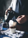 Barista making iced coffee Royalty Free Stock Photo