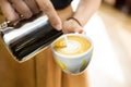 Barista Making milk foam Design On Cappuccino or latte Royalty Free Stock Photo