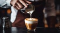 Barista male pouring milk make latte art coffee