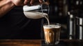 Barista male pouring milk make latte art coffee