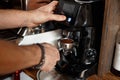 Barista makes coffee, ground grain Royalty Free Stock Photo