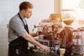 Barista man making italian espresso coffee with espresso machine at the cafe Royalty Free Stock Photo