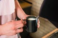 Barista with pitcher make milk foam Royalty Free Stock Photo