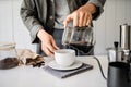 Barista poured water of coffee  on cup with equipment, tool brewing on bar at kitchen home Royalty Free Stock Photo