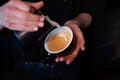 Barista pouring latte foam on coffee, espresso. creating a perfect latte art. dark colours, coffee house Royalty Free Stock Photo