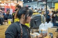 Barista pouring latte froth make coffee latte art