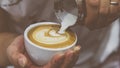 Barista pouring latte froth make coffee latte art Royalty Free Stock Photo