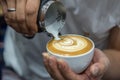 Barista pouring latte froth make coffee latte art Royalty Free Stock Photo