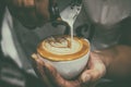Barista pouring latte froth make coffee latte art Royalty Free Stock Photo