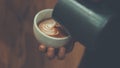 Barista pouring latte froth make coffee latte art Royalty Free Stock Photo