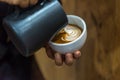 Barista pouring latte froth make coffee latte art Royalty Free Stock Photo