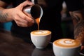 Barista pouring milk into cup of coffee in cafe, A coffee cup in a close up, held by a baristas hand and pouring coffee, AI
