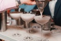 Barista pouring milk foam through a sieve