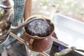 Barista pouring water on coffee ground with filter outdoor Royalty Free Stock Photo