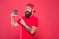 Barista prepared drink for you. Cheerful barista. Man bearded hipster red cap uniform hold paper coffee cup. Barista Royalty Free Stock Photo