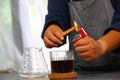 Barista preparing cinnamon put on drip coffee make aroma coffee