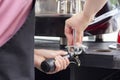 barista preparing for pressing ground coffee Royalty Free Stock Photo