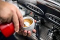 Barista preparing proper cappuccino