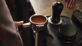 Barista Pressing Down Coffee Beans. Process of Making Fresh Coffee on Professional Machine. 4K, Slowmotion.