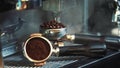 Barista roasting coffee beans grinder on coffee espresso machine