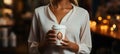 Barista\'s touch Waitress presents a paper cup of steaming coffee with grace