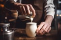 A barista skillfully steaming milk to create velvety microfoam, essential for crafting creamy cappuccinos and lattes. Generative Royalty Free Stock Photo