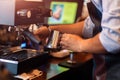 Barista steaming milk in the pitcher with coffee machine for  preparing to make latte art Royalty Free Stock Photo