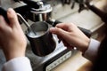 Barista steaming milk using modern coffee machine Royalty Free Stock Photo