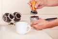 Barista tamp ground coffee with tamper on table Royalty Free Stock Photo